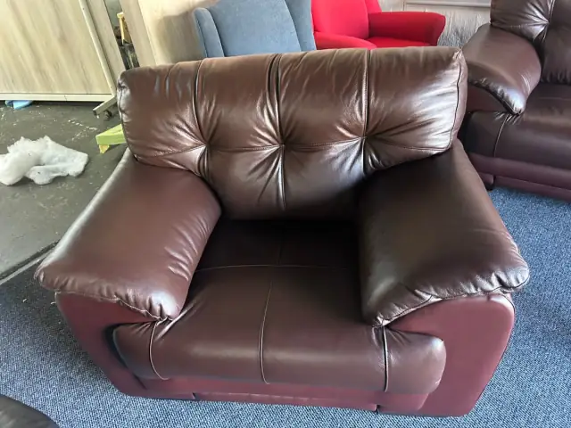 An armchair in burgundy leather
