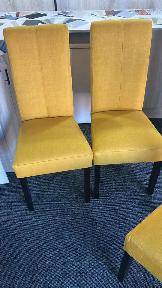 High-back dining chairs in mustard yellow