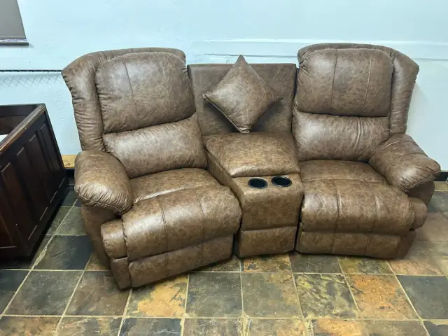 A two-seater recliner in brown leather