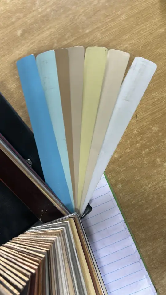 Aluminium venetian slat colours and a wooden slat sample book