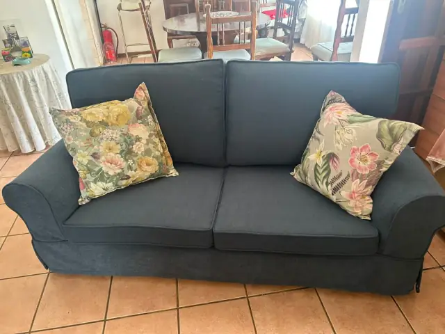 A two-seater sofa in navy blue