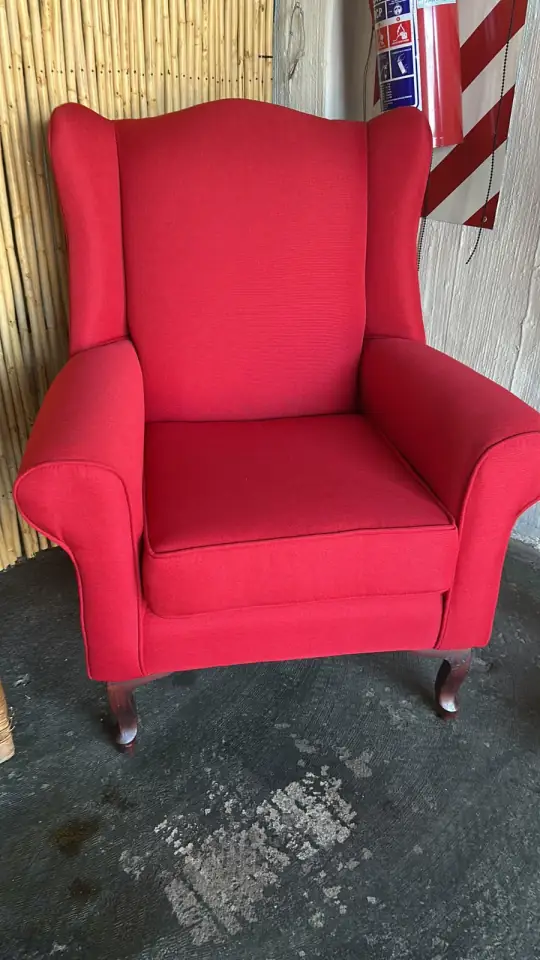 A wingback chair in red