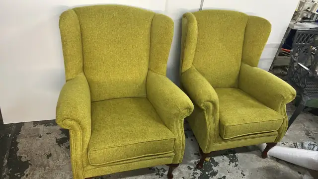 A pair of wingback chairs in chartreuse